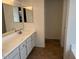 Bright bathroom with double mirrors, long vanity and tile floors at 3922 N Creosote Ct, Casa Grande, AZ 85122