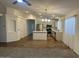 Open kitchen with stainless steel appliances, a center island and neutral tiling at 3922 N Creosote Ct, Casa Grande, AZ 85122