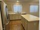 Bright kitchen featuring stainless steel appliances and an island with granite countertop at 3922 N Creosote Ct, Casa Grande, AZ 85122