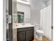 Compact bathroom with a vanity, toilet, and shower-tub combo, offering functionality at 4512 W Stoneman Dr, Anthem, AZ 85086