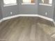 Bedroom featuring new wood floors, baseboard trim, and lots of natural light at 4512 W Stoneman Dr, Anthem, AZ 85086