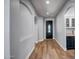 Inviting entryway with wood floors and a decorative front door, leading into the home's interior at 4512 W Stoneman Dr, Anthem, AZ 85086
