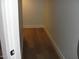 Narrow hallway with baseboard trim and new wood floors at 4512 W Stoneman Dr, Anthem, AZ 85086