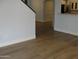 Open living room featuring new wood floors and neutral paint at 4512 W Stoneman Dr, Anthem, AZ 85086