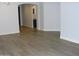 Large open living room and dining room featuring wood floors at 4512 W Stoneman Dr, Anthem, AZ 85086
