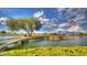 Scenic pond with lush foliage, bridge and verdant golf course view at 6429 S Honor Ct, Gilbert, AZ 85298