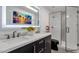 Modern bathroom with double vanity, frameless shower, and stylish decor at 7401 N Scottsdale Rd # 3, Paradise Valley, AZ 85253