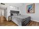 Modern bedroom with a tufted headboard and wood flooring at 7401 N Scottsdale Rd # 3, Paradise Valley, AZ 85253