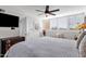 Comfortable bedroom with a large bed and ceiling fan at 7401 N Scottsdale Rd # 3, Paradise Valley, AZ 85253