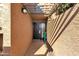 Private entryway with a covered walkway and dark brown door at 7401 N Scottsdale Rd # 3, Paradise Valley, AZ 85253