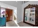 Bright and spacious entryway with a large mirror and staircase at 7401 N Scottsdale Rd # 3, Paradise Valley, AZ 85253
