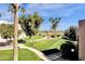 Grounds with lush landscaping, palm trees, and walking path at 7401 N Scottsdale Rd # 3, Paradise Valley, AZ 85253