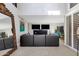 Spacious living room with a large mirror and sectional sofa at 7401 N Scottsdale Rd # 3, Paradise Valley, AZ 85253