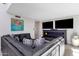 Spacious living room with sectional sofa and flat-screen TVs at 7401 N Scottsdale Rd # 3, Paradise Valley, AZ 85253