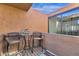 Private patio with small table and chairs, perfect for relaxing at 7401 N Scottsdale Rd # 3, Paradise Valley, AZ 85253