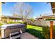 Relax in this backyard oasis featuring a lush lawn and inviting hot tub at 38 W Lynwood St, Phoenix, AZ 85003