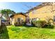 Expansive backyard with fresh sod, mature trees, and a charming exterior at 38 W Lynwood St, Phoenix, AZ 85003