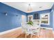 Bright dining room with hardwood floors and a modern light fixture at 38 W Lynwood St, Phoenix, AZ 85003