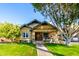 Quaint bungalow with lush lawn, welcoming front porch and walkway at 38 W Lynwood St, Phoenix, AZ 85003