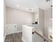 Well-lit upstairs landing with a view to office space and wood laminate flooring at 38 W Lynwood St, Phoenix, AZ 85003