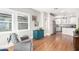 Bright living area with hardwood floors, comfortable seating, and view into kitchen at 38 W Lynwood St, Phoenix, AZ 85003
