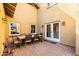 Charming outdoor patio with travertine pavers and stylish patio table set at 38 W Lynwood St, Phoenix, AZ 85003