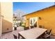 Private outdoor patio with travertine pavers, hot tub, and outdoor lighting at 38 W Lynwood St, Phoenix, AZ 85003