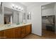 This bathroom features double sinks, generous counter space and a walk-in closet at 9445 N 94Th Pl # 102, Scottsdale, AZ 85258