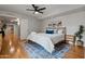 Cozy bedroom has stylish rug and a bed, with views into other rooms at 9445 N 94Th Pl # 102, Scottsdale, AZ 85258