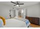 Bedroom features an inviting bed with a view into the living room and hall at 9445 N 94Th Pl # 102, Scottsdale, AZ 85258