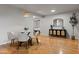 Charming dining room with a glass table and a view into the bedroom at 9445 N 94Th Pl # 102, Scottsdale, AZ 85258