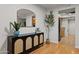 Stylish entryway with a decorative mirror and console table with storage at 9445 N 94Th Pl # 102, Scottsdale, AZ 85258