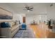 Bright living space with a comfortable sofa and a view of the front entry at 9445 N 94Th Pl # 102, Scottsdale, AZ 85258