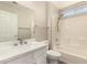 Bathroom featuring vanity and tub with tile surround at 13335 W Broken Arrow Dr, Sun City West, AZ 85375