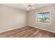 Neutral bedroom with wood-look floors and a ceiling fan at 13335 W Broken Arrow Dr, Sun City West, AZ 85375