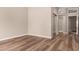 Neutral bedroom with wood-look floors and a view of closet entrance at 13335 W Broken Arrow Dr, Sun City West, AZ 85375