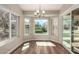 Dining area featuring three windows that provide a lovely view of the outside, bright area at 13335 W Broken Arrow Dr, Sun City West, AZ 85375