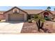 Inviting home exterior with a well-kept yard, tile roof, and attached garage at 13335 W Broken Arrow Dr, Sun City West, AZ 85375