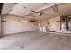 Spacious garage including laundry hookups, storage, and epoxy floors at 13335 W Broken Arrow Dr, Sun City West, AZ 85375