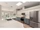Modern kitchen boasting a skylight, stainless appliances, and a large island at 13335 W Broken Arrow Dr, Sun City West, AZ 85375