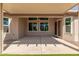 Covered patio featuring fan, ceiling and view of landscaped backyard at 13335 W Broken Arrow Dr, Sun City West, AZ 85375