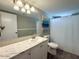 Bathroom featuring a vanity with a marble countertop and a shower with white curtain at 2044 W 9Th Ave, Apache Junction, AZ 85120