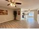 Open concept living room flowing into kitchen with stainless steel appliances at 2044 W 9Th Ave, Apache Junction, AZ 85120