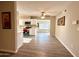 Open floorplan living room and kitchen with stainless steel appliances and bright light at 2044 W 9Th Ave, Apache Junction, AZ 85120