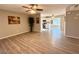 Open concept living room with wood-look floors flowing into an adjacent kitchen at 2044 W 9Th Ave, Apache Junction, AZ 85120