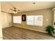 Bright and airy living room with neutral colors, a ceiling fan, and large windows at 2044 W 9Th Ave, Apache Junction, AZ 85120