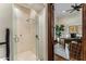 This modern tiled shower has a clear glass door and sleek chrome fixtures at 6515 E Stallion Rd, Paradise Valley, AZ 85253