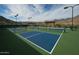 Well-maintained pickleball courts with mountain backdrop at 20428 W Elm Dr, Buckeye, AZ 85396