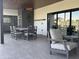 Spacious patio with dining and lounge areas, ideal for outdoor entertaining and relaxation by the pool at 7544 E Mckinley St, Scottsdale, AZ 85257