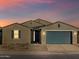 Single-story home with teal garage door and desert landscaping at 2618 E San Miguel Dr, Casa Grande, AZ 85194